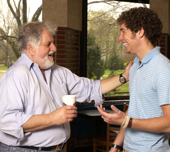 Salvatore Primeggia ’64, M.A. ’66 talks with a student on campus
