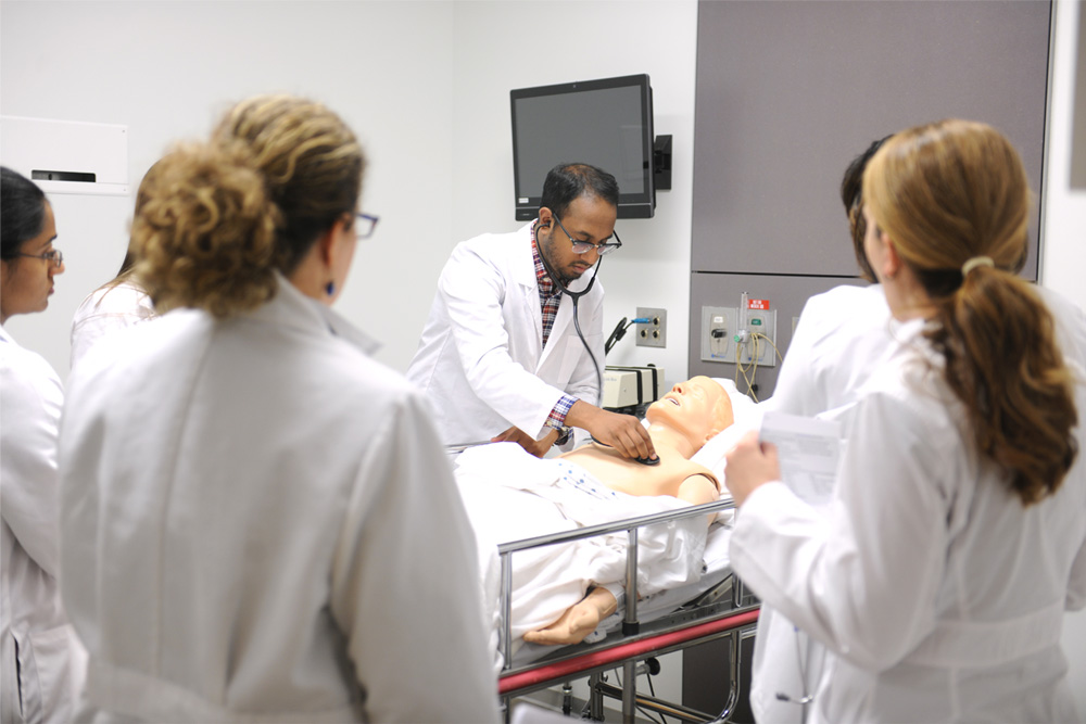 Nursing students working in the simulation lab